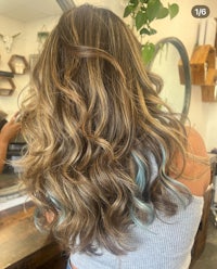the back of a woman's hair in a salon