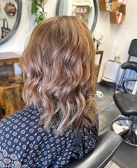 the back of a woman's hair in a salon