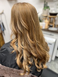 the back of a woman's hair in a salon