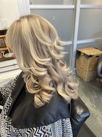 a blonde woman's hair in a salon