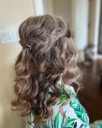 the back of a woman's hair with curls